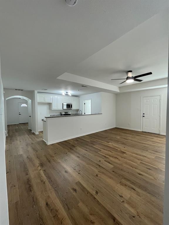 212 Mineral Wells Street Terrell, TX 75160 - Photo 3 of 16 a view of a kitchen with a sink and cabinets