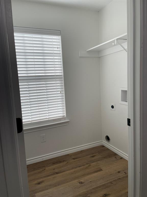 212 Mineral Wells Street Terrell, TX 75160 - Photo 6 of 16 a view of a small space with wooden floor and a window