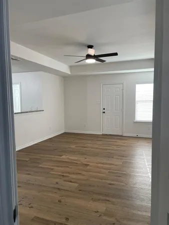 a view of an empty room with a window