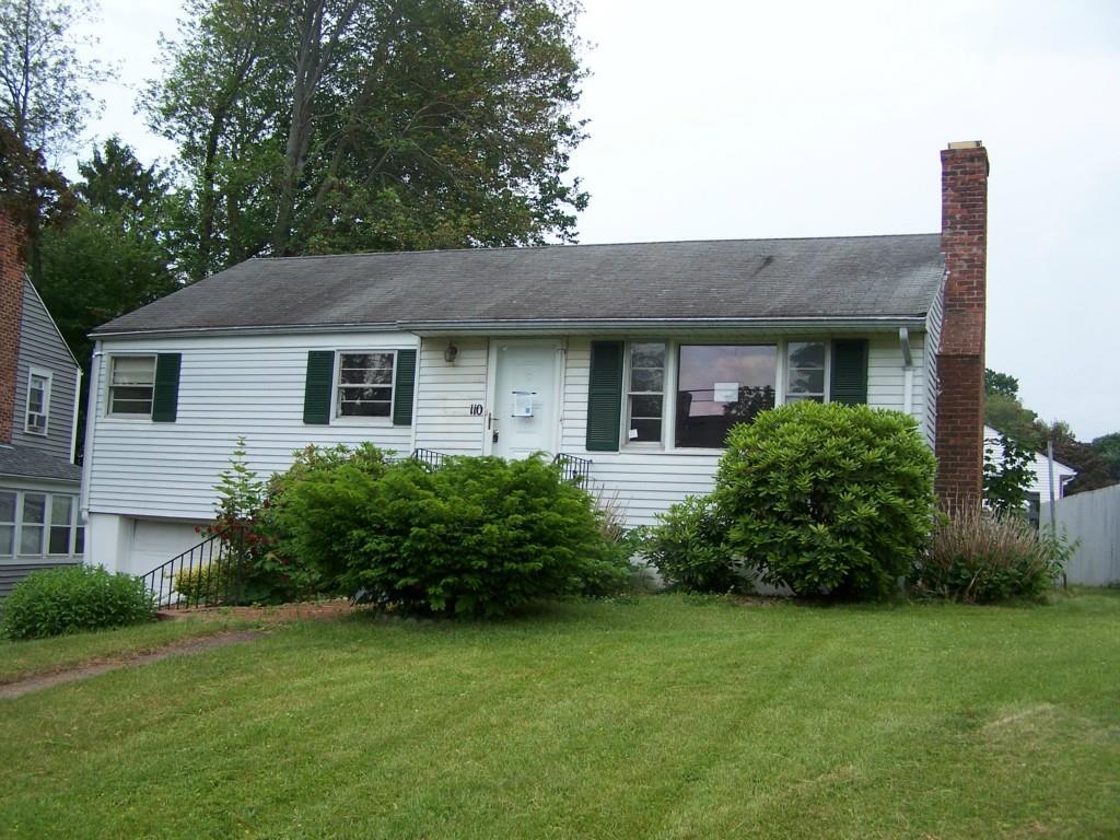 110 Wells Road Wethersfield, CT 06109 - Photo 1 of 1 a front view of a house with garden
