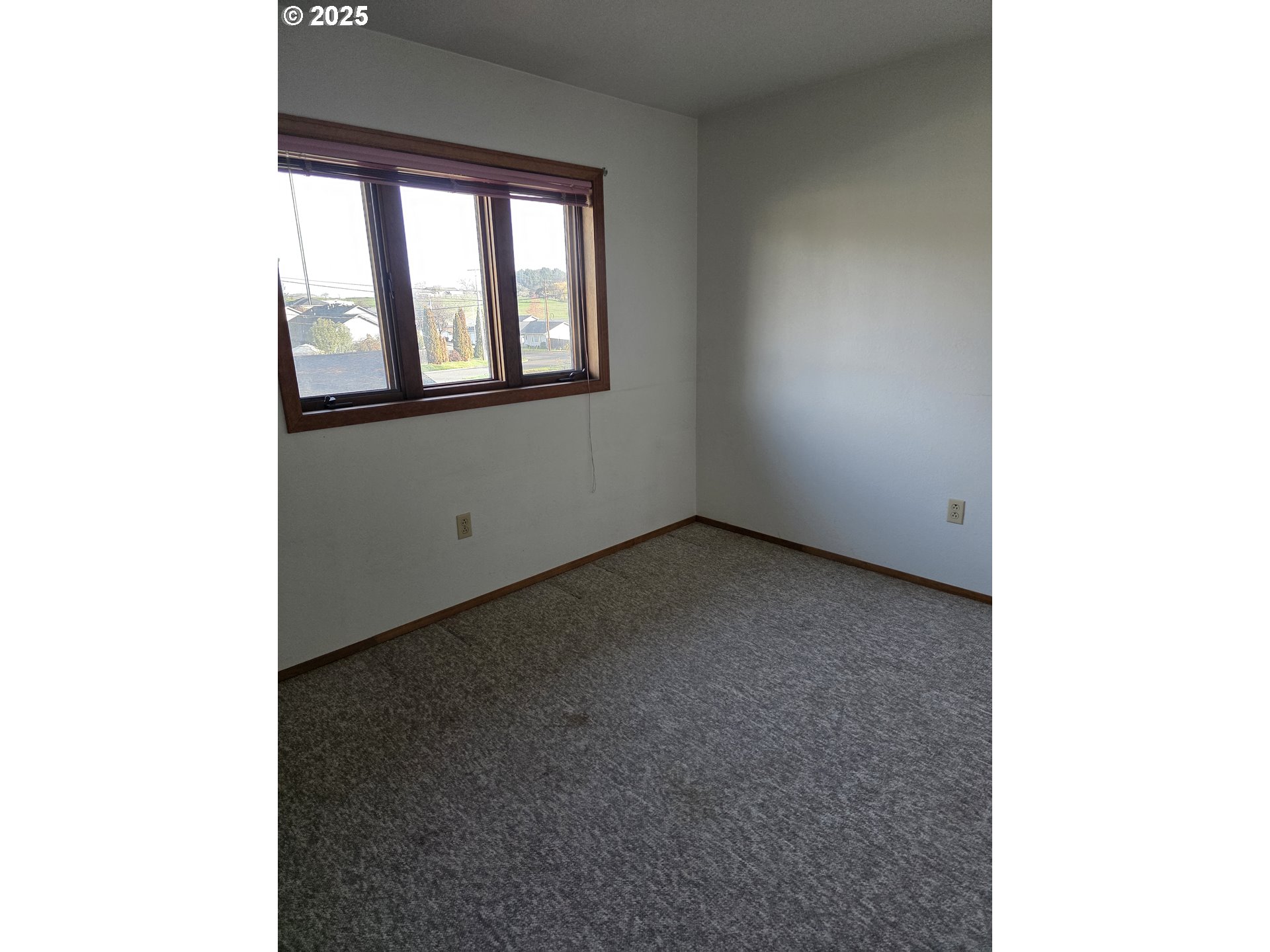 291 Southeast Shigley Street Winston, OR 97496 - Photo 19 of 27 a view of an empty room with a window