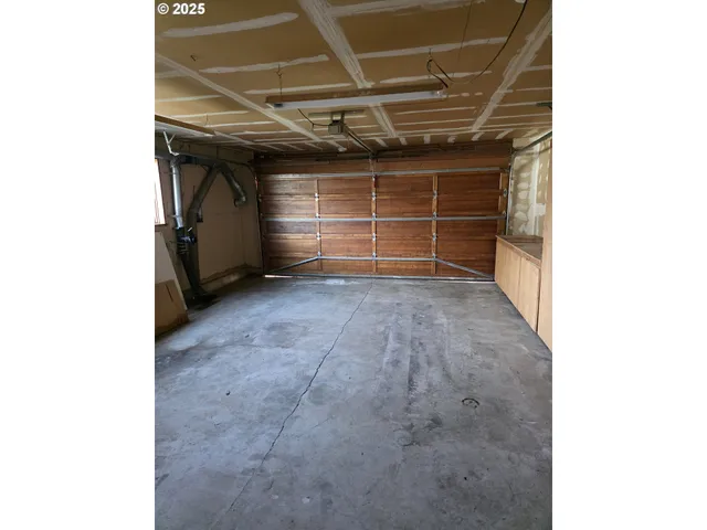 a view of room with garage and window