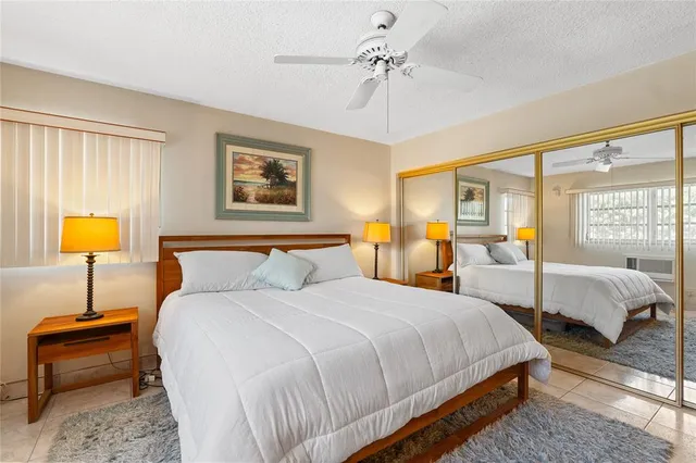 a bedroom with bed and a lamp