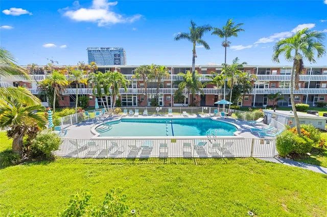 a view of a swimming pool with a patio