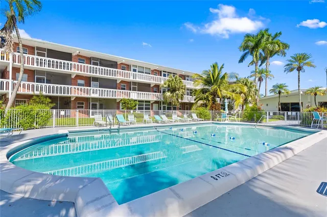 a view of a swimming pool with a patio