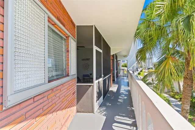 a view of balcony with furniture