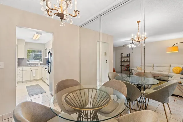 a living room with furniture and chandelier