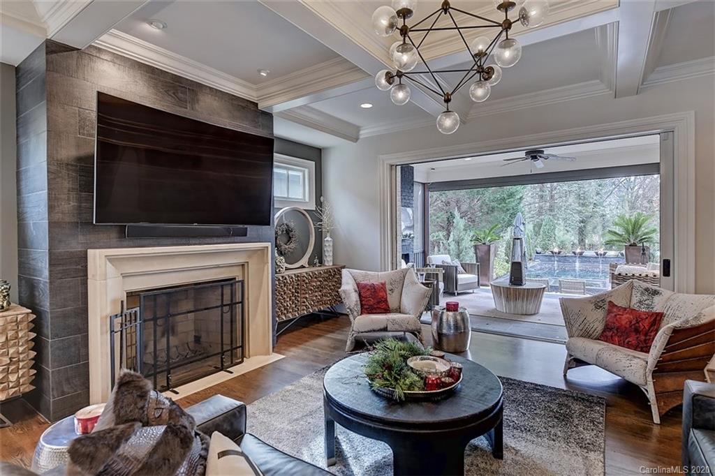 2346 Overhill Road Charlotte, NC 28211 - Photo 2 of 38 a living room with furniture a fireplace and a flat screen tv