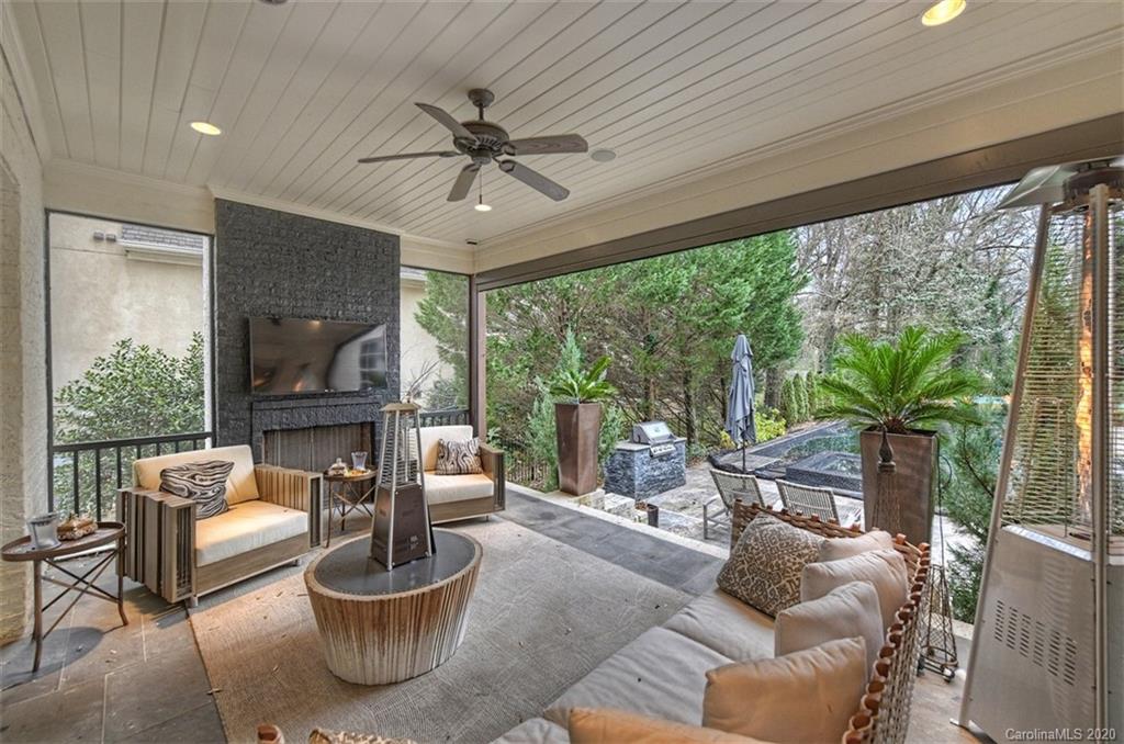 2346 Overhill Road Charlotte, NC 28211 - Photo 3 of 38 a living room with furniture a flat screen tv and a large window