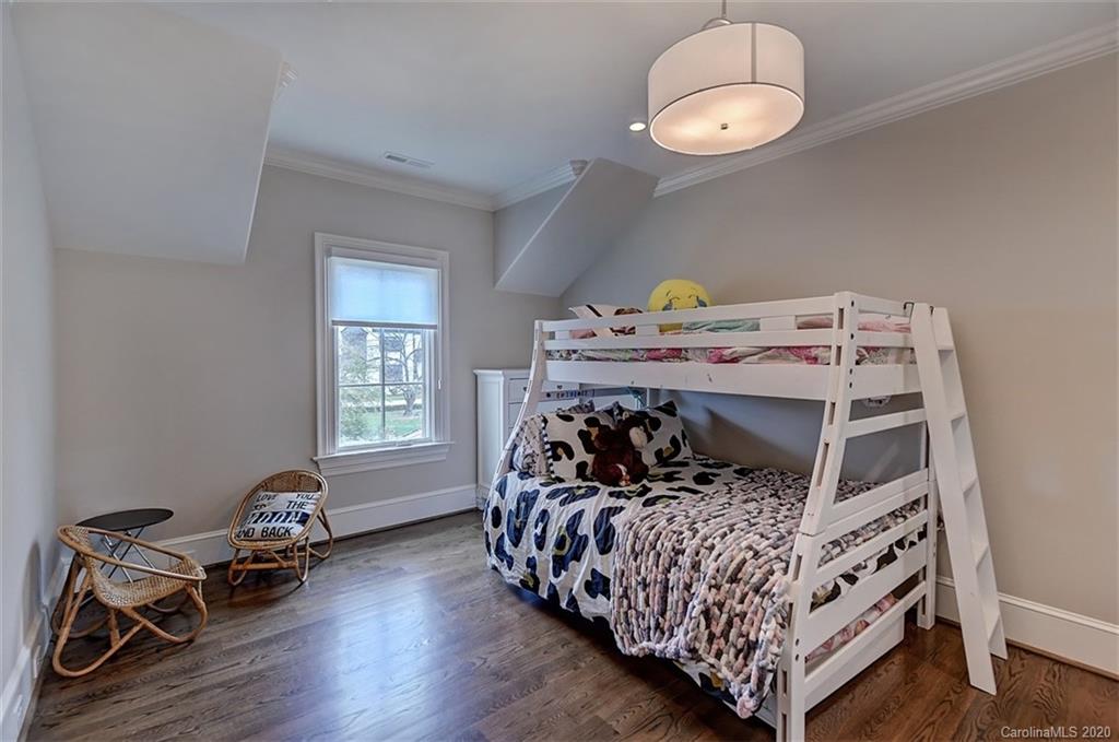 2346 Overhill Road Charlotte, NC 28211 - Photo 23 of 38 a bedroom with a bed and wooden floor