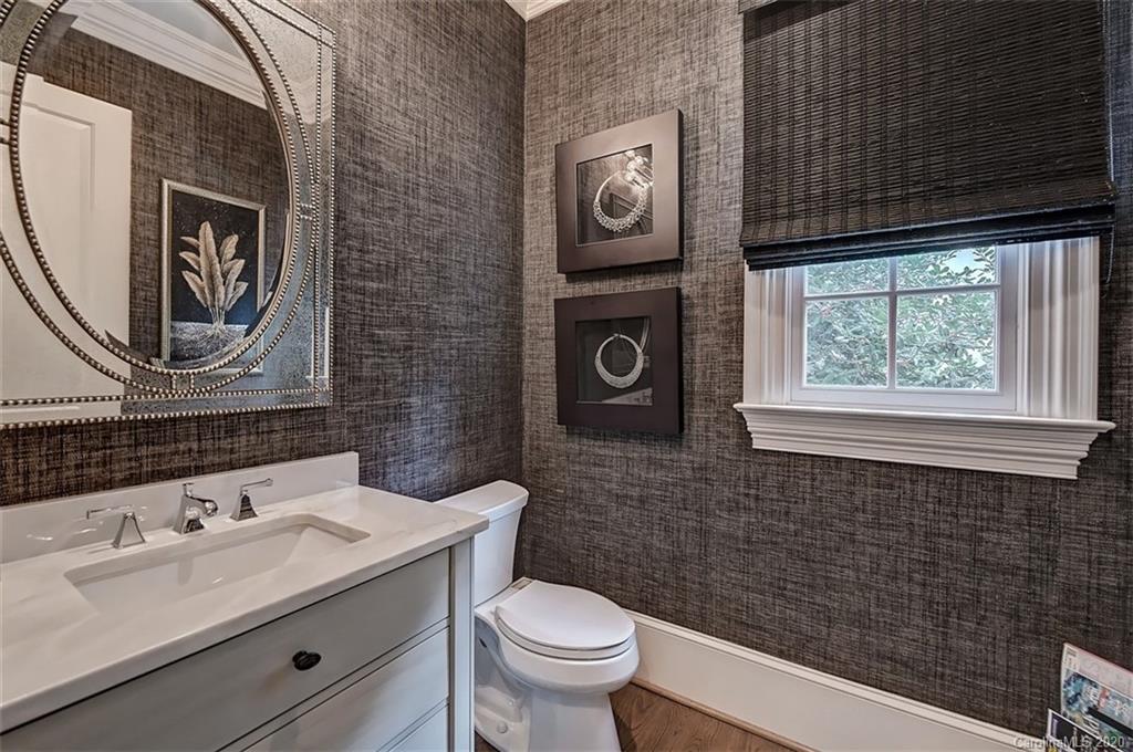 2346 Overhill Road Charlotte, NC 28211 - Photo 28 of 38 a bathroom with a toilet a sink and mirror