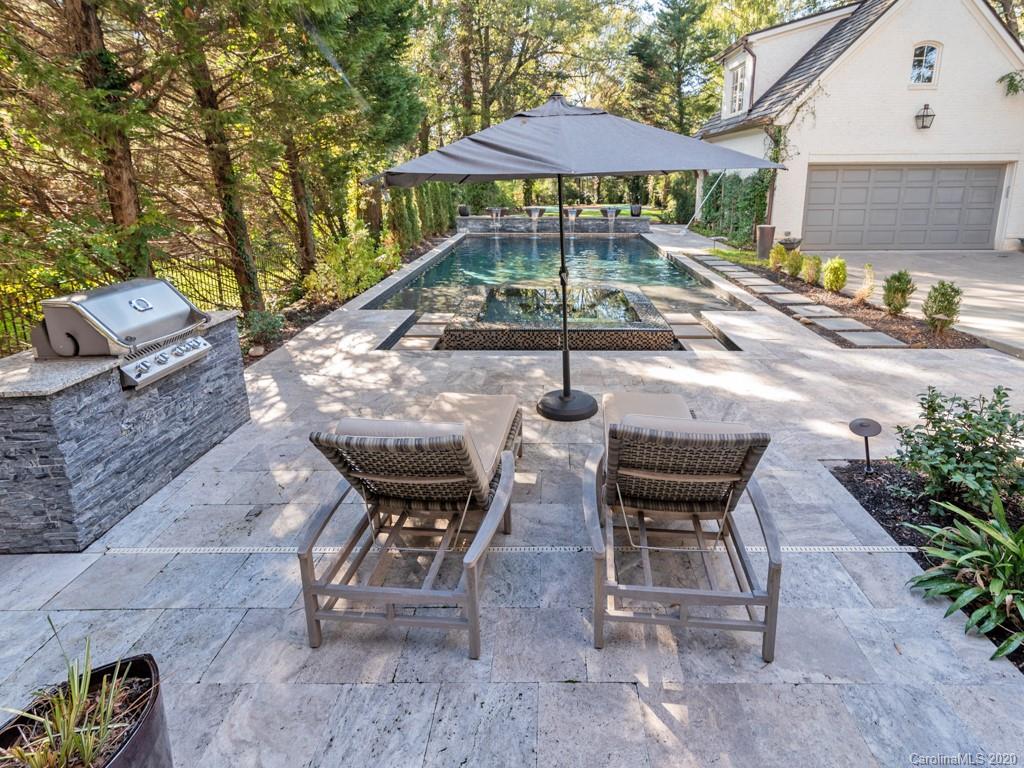 2346 Overhill Road Charlotte, NC 28211 - Photo 32 of 38 a view of a backyard with furniture and a table