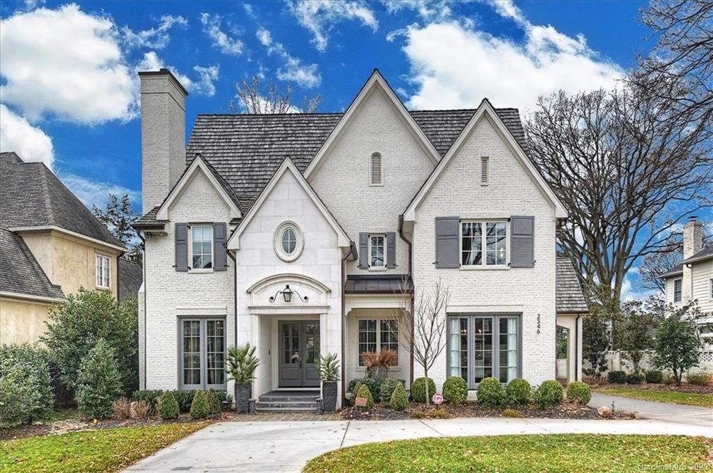 2346 Overhill Road Charlotte, NC 28211 - Photo 38 of 38 a view of a brick house with a clock on the side of a yard