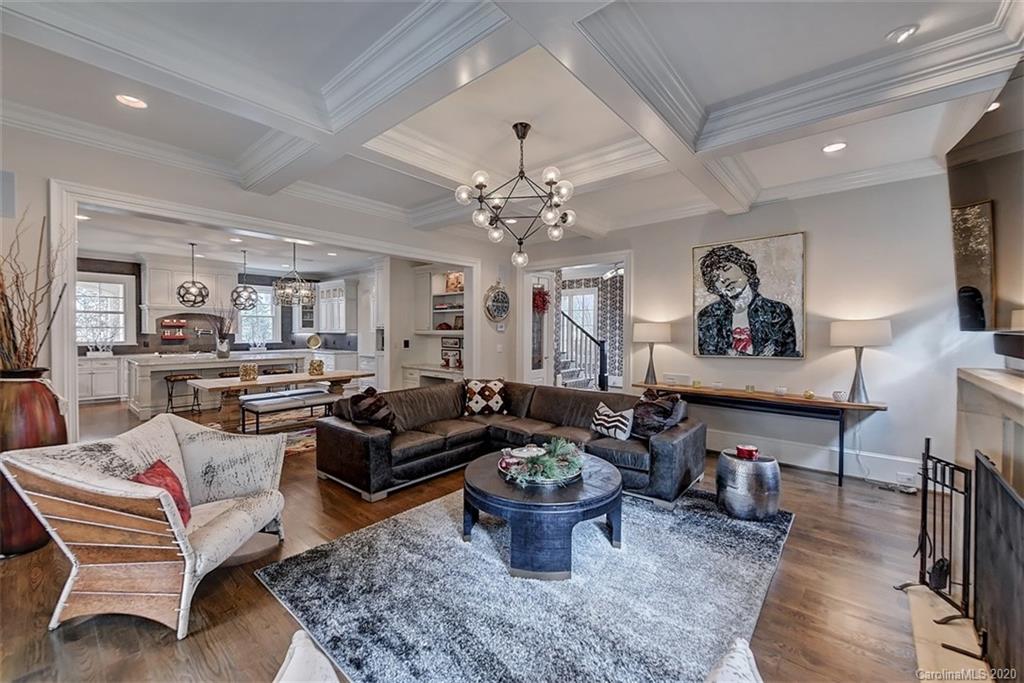 2346 Overhill Road Charlotte, NC 28211 - Photo 6 of 38 a living room with furniture a rug and a chandelier