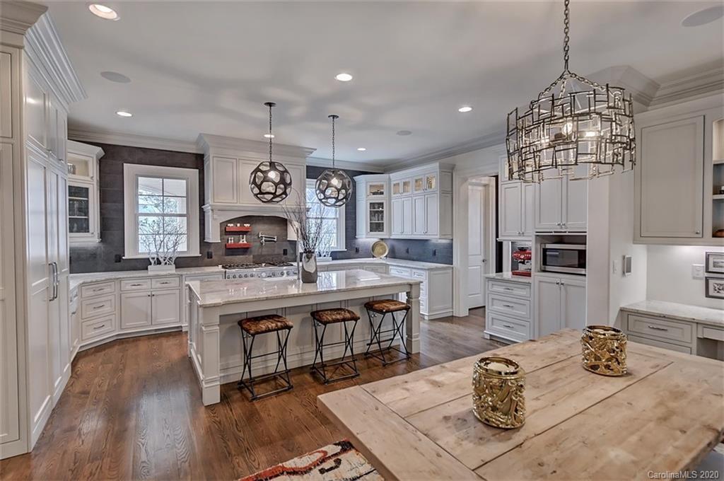 2346 Overhill Road Charlotte, NC 28211 - Photo 8 of 38 a large kitchen with a table and chairs