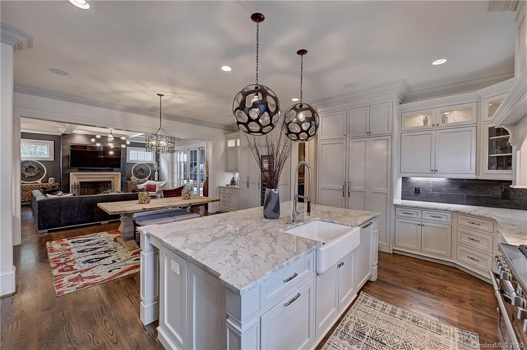 2346 Overhill Road Charlotte, NC 28211 - Photo 9 of 38 a large kitchen with kitchen island a large island in it