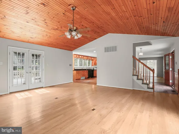 a spacious bathroom with a sink a mirror and a bathtub