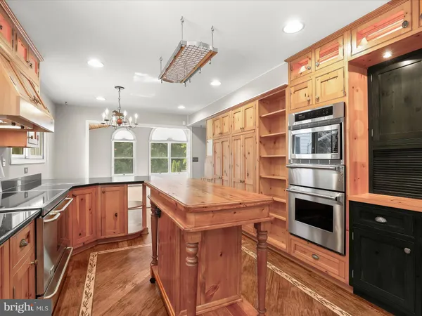 a view of backyard with wooden floor and fence