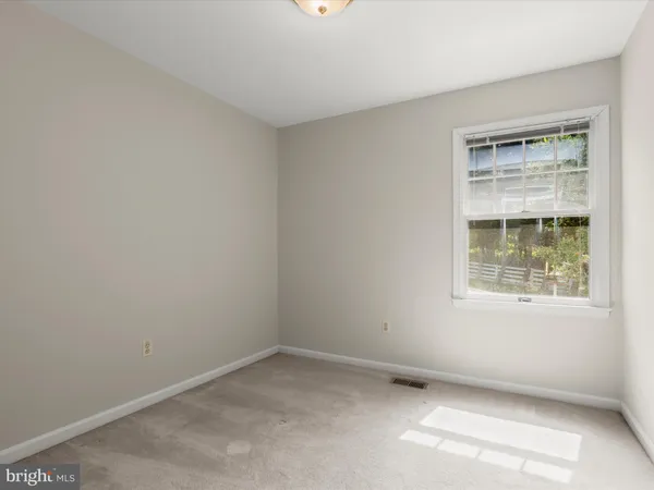 an aerial view of a houses with a yard