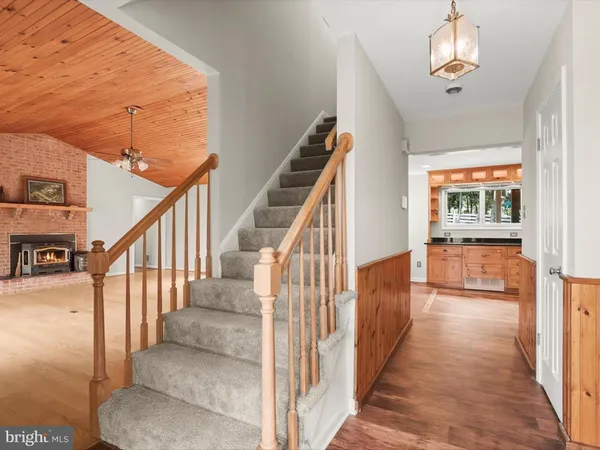 a dining room with furniture and a window