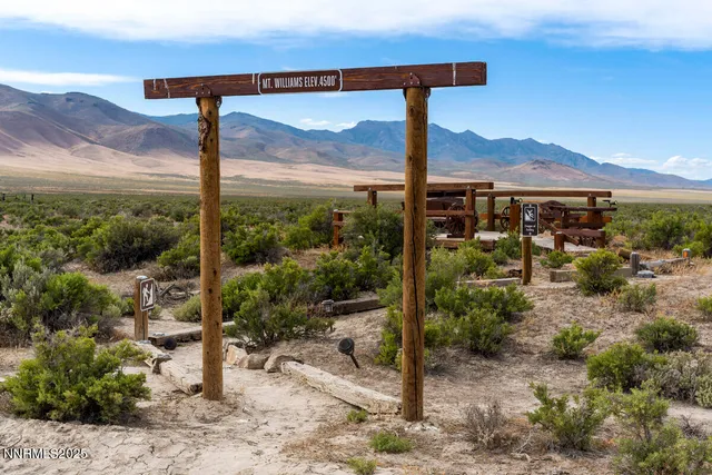 a view of a terrace with furniture and mountain view