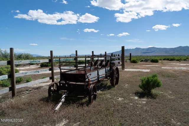 a view of a yard with furniture and mountain view