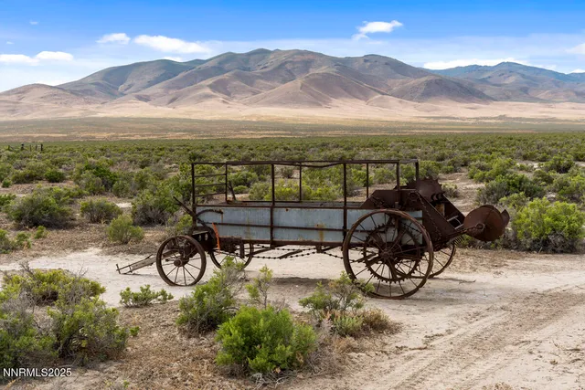 a living room with furniture a flat screen tv and a window