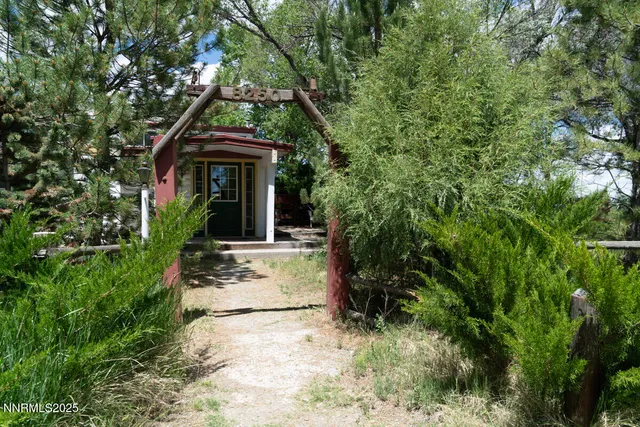 a view of a livingroom with furniture and a flat screen tv