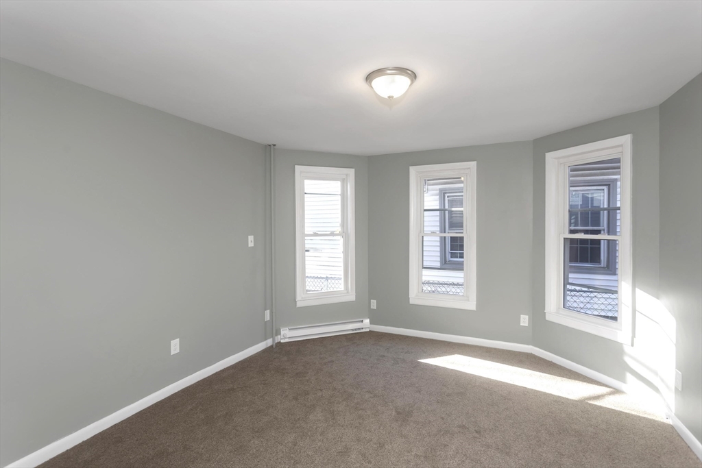 49 View Street Holyoke, MA 01040 - Photo 11 of 34 an empty room with windows