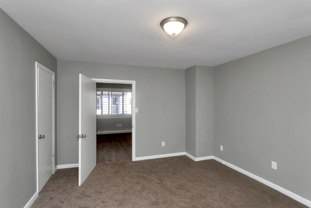 49 View Street Holyoke, MA 01040 - Photo 13 of 34 a view of an empty room with a window