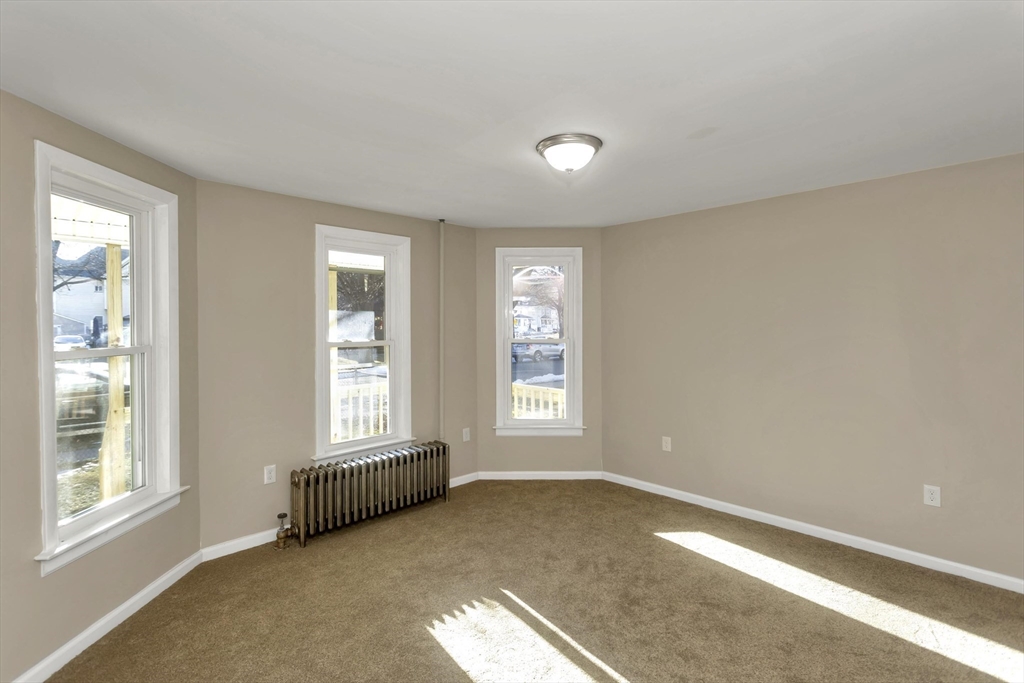 49 View Street Holyoke, MA 01040 - Photo 14 of 34 a view of an empty room with a window