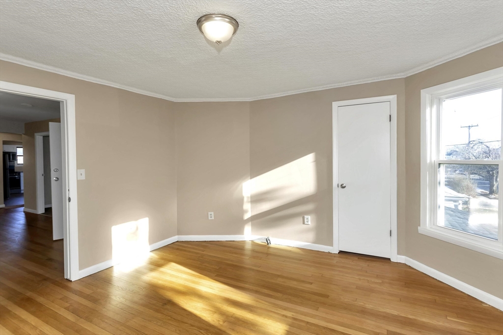 49 View Street Holyoke, MA 01040 - Photo 17 of 34 a view of empty room with wooden floor and fan