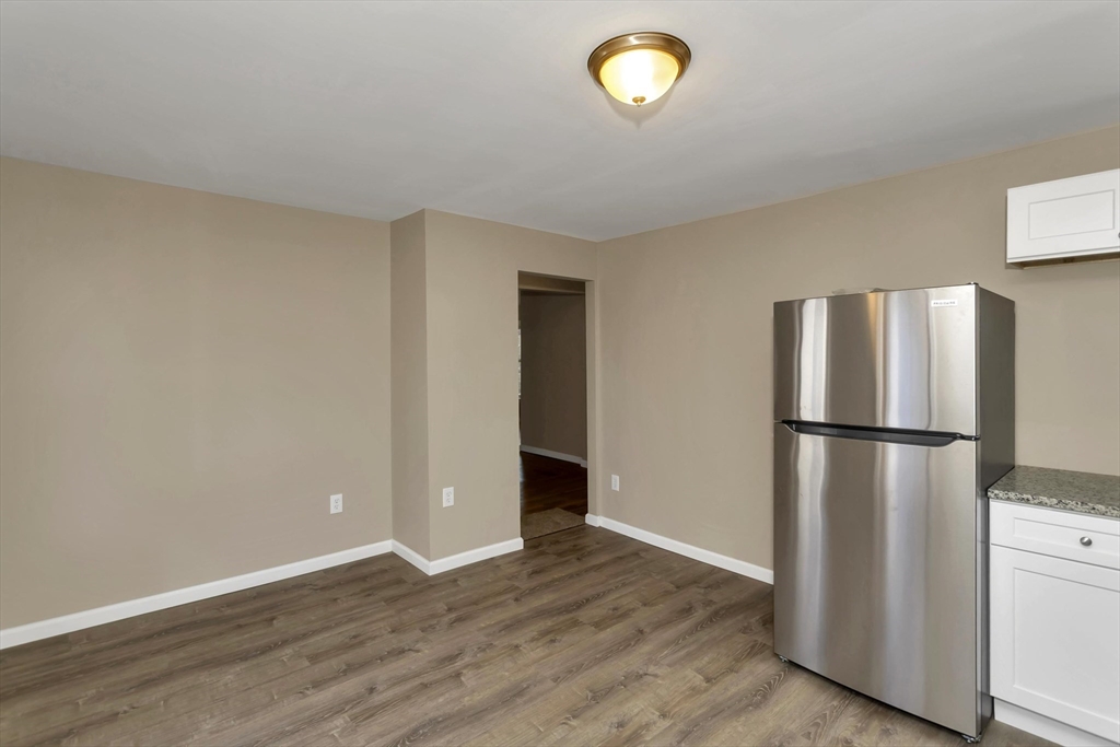 49 View Street Holyoke, MA 01040 - Photo 20 of 34 a view of a kitchen with a refrigerator and a stove