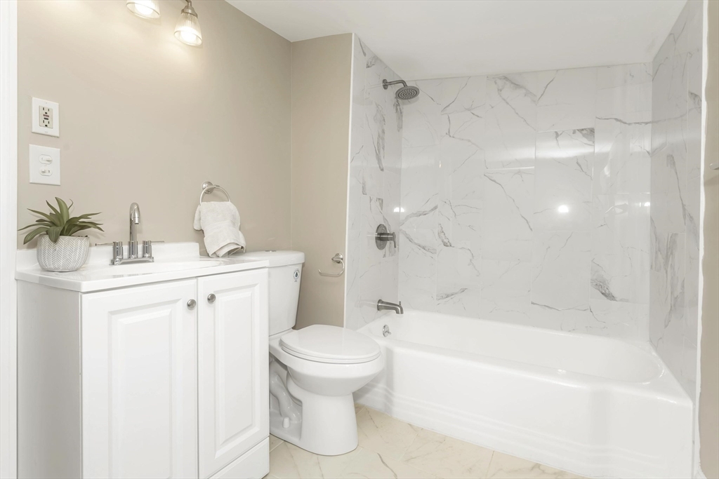 49 View Street Holyoke, MA 01040 - Photo 21 of 34 a bathroom with a sink toilet and shower