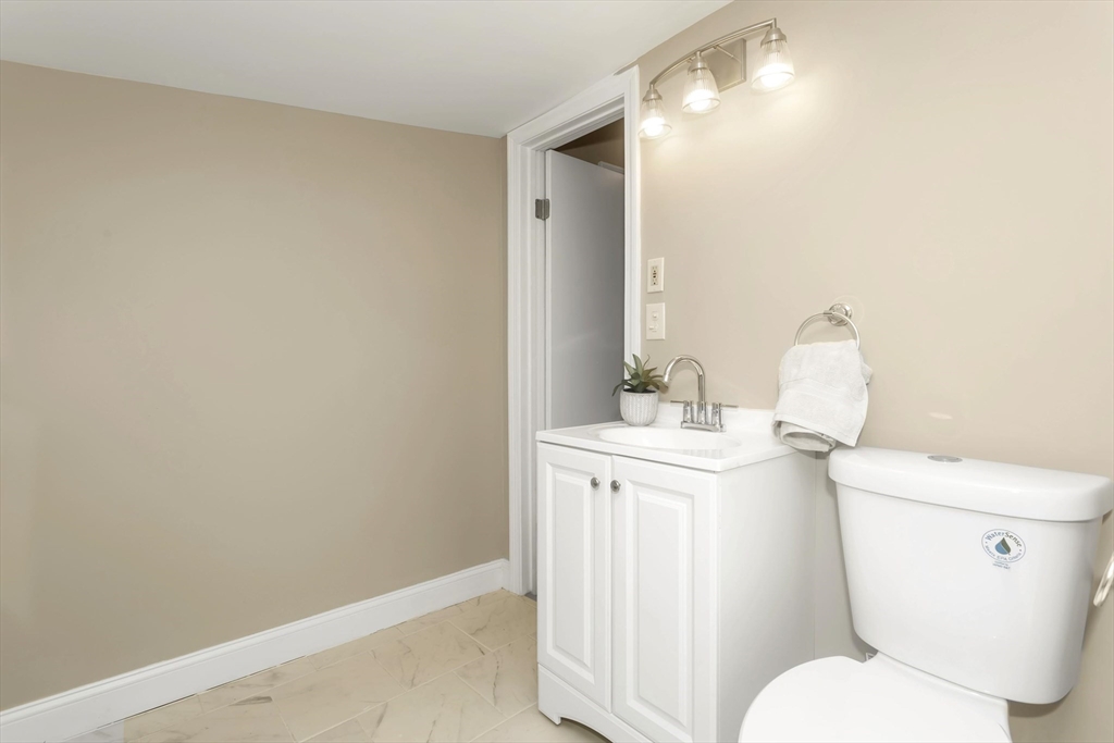 49 View Street Holyoke, MA 01040 - Photo 22 of 34 a white toilet sitting next to a bathroom sink