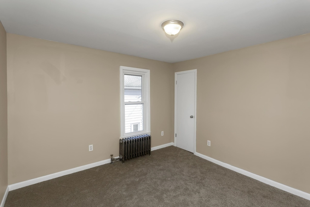 49 View Street Holyoke, MA 01040 - Photo 27 of 34 an empty room with windows
