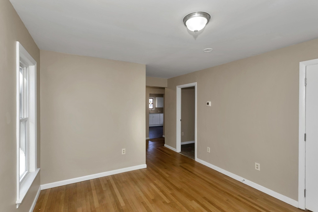 49 View Street Holyoke, MA 01040 - Photo 30 of 34 wooden floor in an empty room with a window