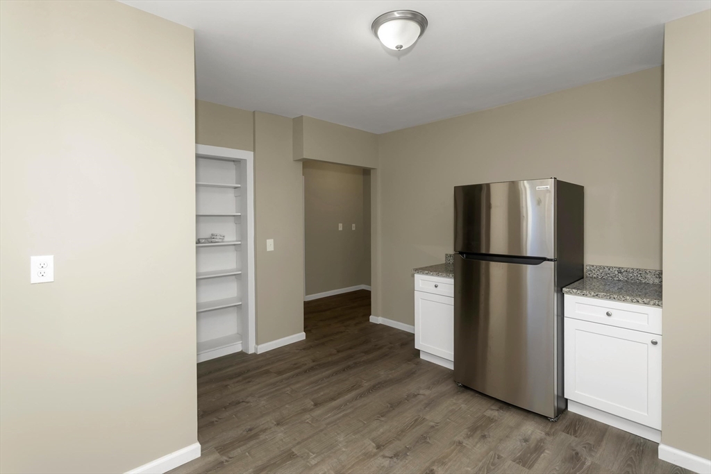 49 View Street Holyoke, MA 01040 - Photo 4 of 34 a view of kitchen view with cabinets and stainless steel appliances