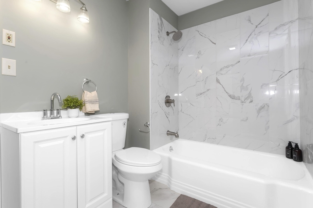 49 View Street Holyoke, MA 01040 - Photo 5 of 34 a bathroom with a sink a toilet and shower