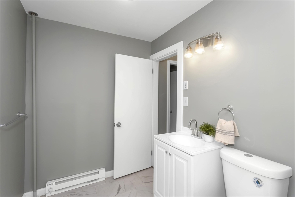 49 View Street Holyoke, MA 01040 - Photo 6 of 34 a bathroom with a sink vanity and toilet