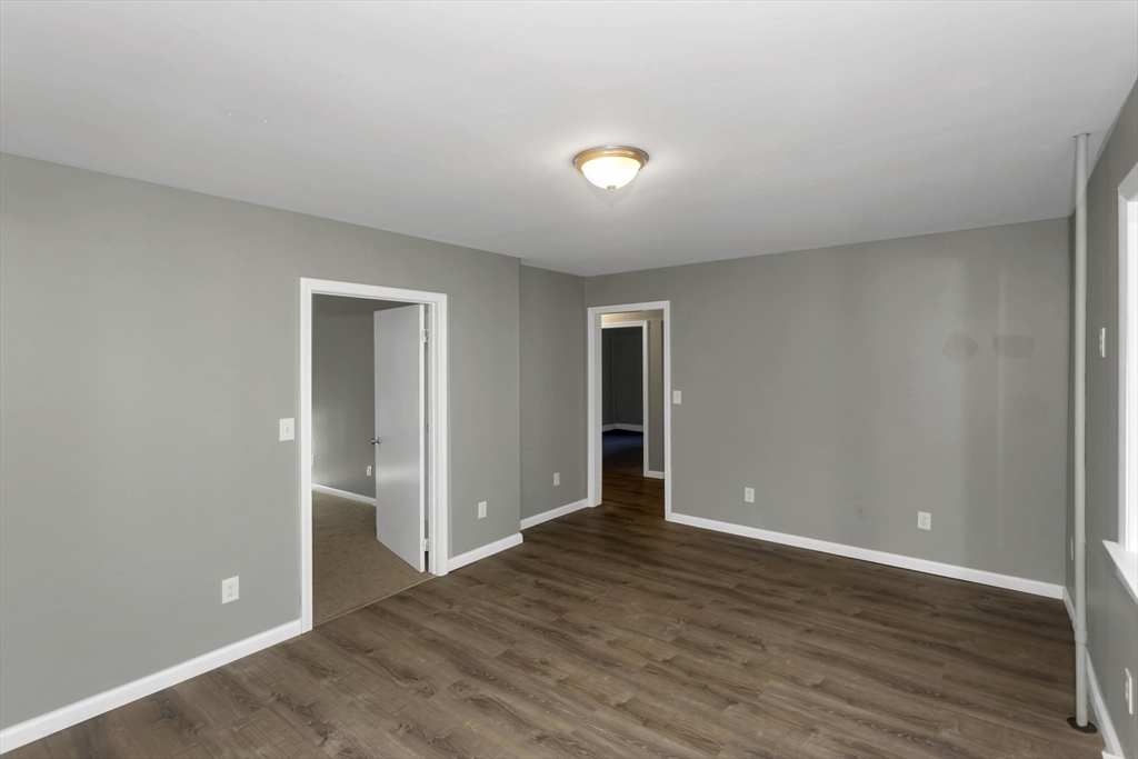 49 View Street Holyoke, MA 01040 - Photo 9 of 34 wooden floor in an empty room
