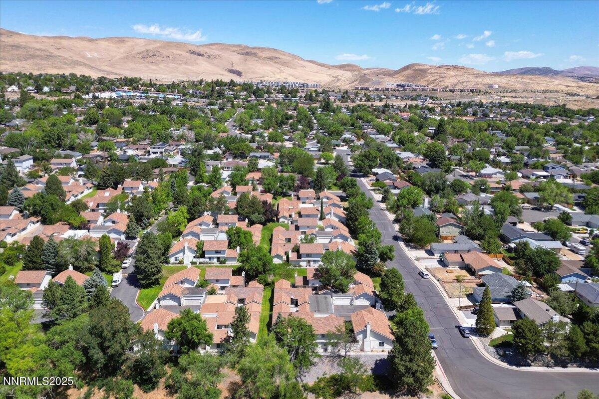 1161 Rayburn Drive Reno, NV 89503 - Photo 35 of 37 an aerial view of a city with lots of residential buildings and mountain view in back