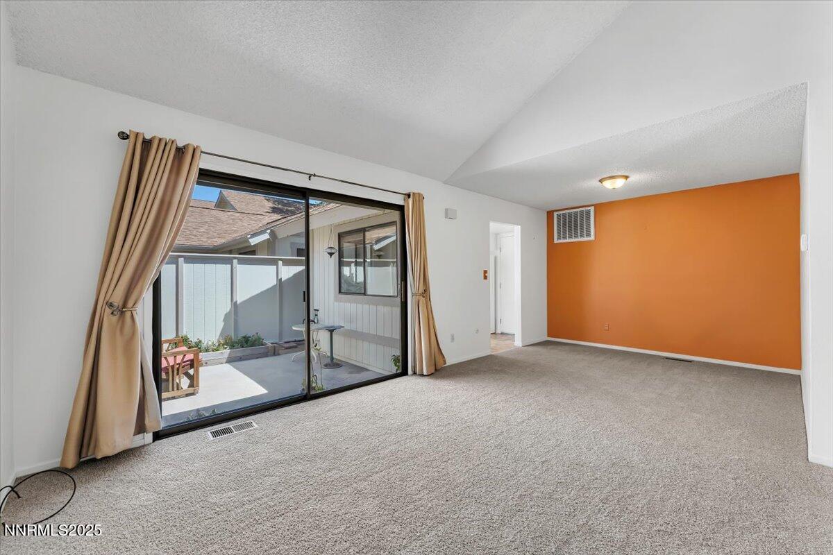 1161 Rayburn Drive Reno, NV 89503 - Photo 10 of 37 an empty room with sliding door and mirror