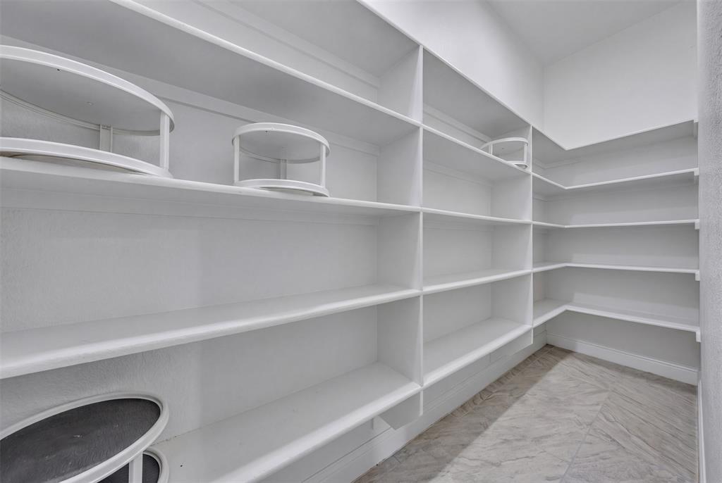 1060 Waters Edge Court Oak Point, TX 75068 - Photo 22 of 40 a view of a room with shelf
