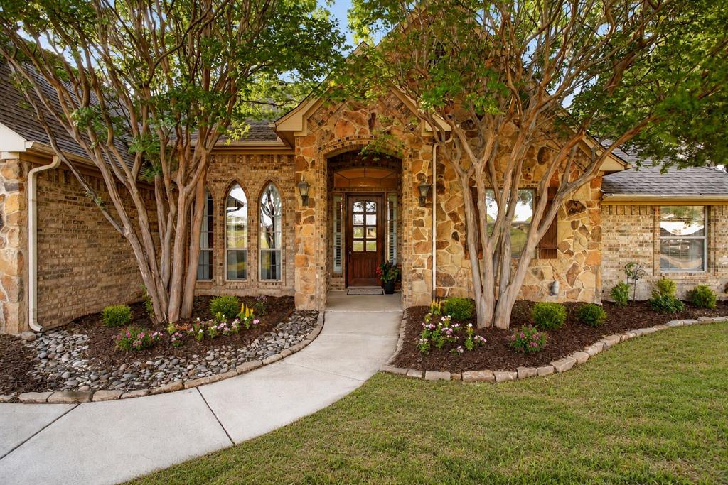 Welcome HOME to 128 Canyon Ridge Trail in coveted Aledo ISD!