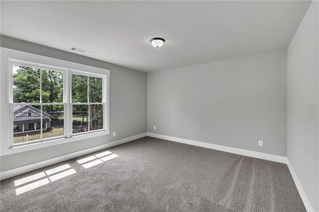 229 East Marable Street Monroe, GA 30655 - Photo 25 of 39 an empty room with a window