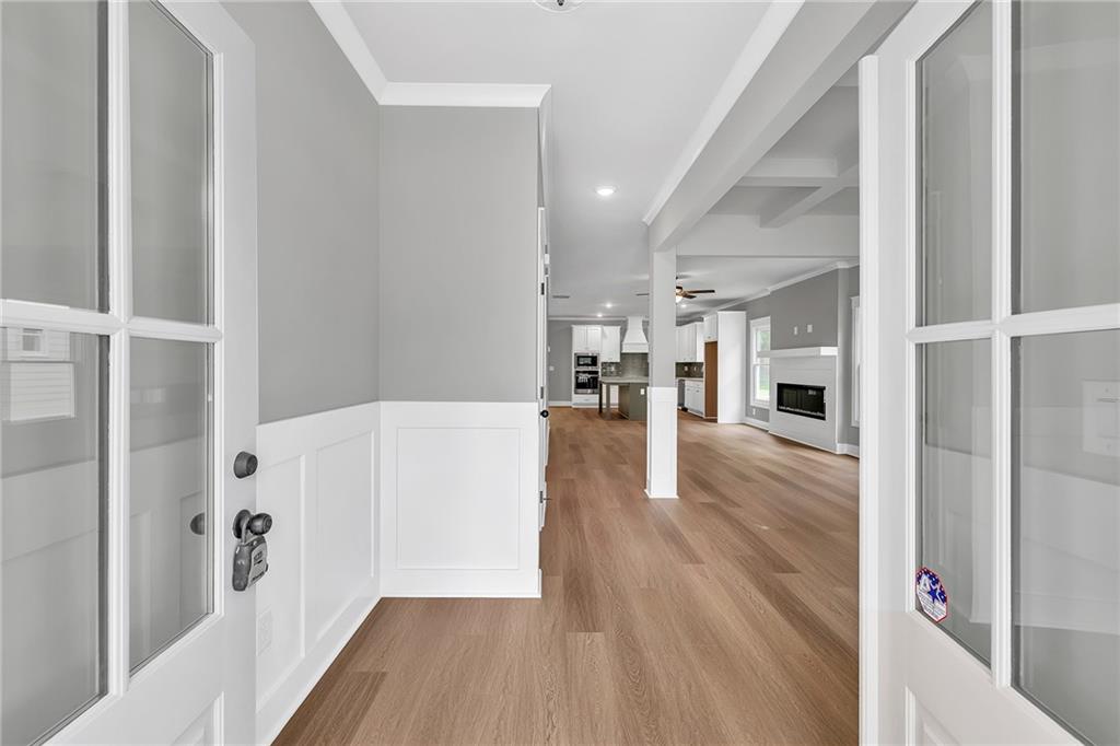 229 East Marable Street Monroe, GA 30655 - Photo 3 of 39 a view of a living room and a refrigerator