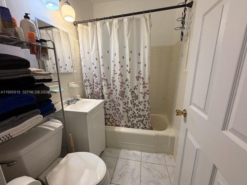 446 Northwest 45th Street Miami, FL 33127 - Photo 15 of 15 a bathroom with a toilet and shower