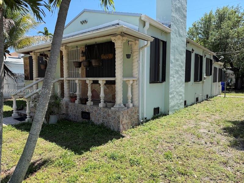 446 Northwest 45th Street Miami, FL 33127 - Photo 2 of 15 a view of a house with backyard and porch