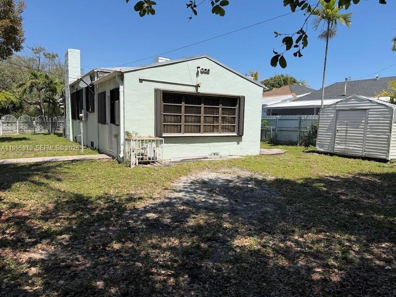 446 Northwest 45th Street Miami, FL 33127 - Photo 4 of 15 a front view of a house with a yard